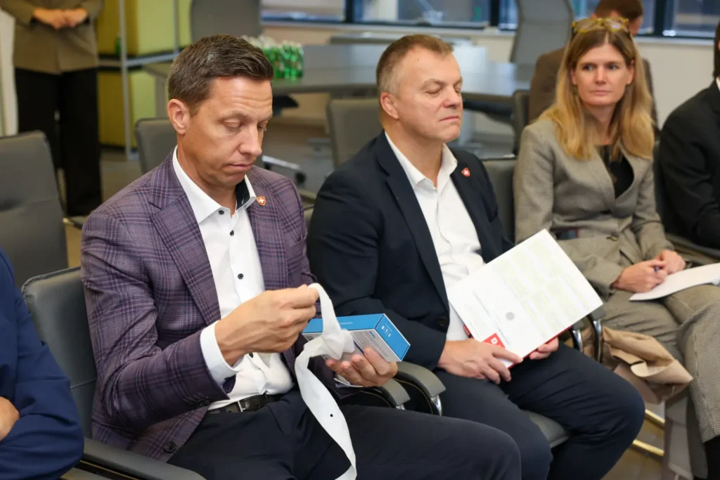 Members of the Swiss delegation examining the Baby FM wearable temperature sensor